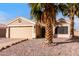 Charming single-story home with a two car garage, desert landscaping and mature palm trees at 11178 W Echo Ln, Peoria, AZ 85345