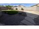 Low maintenance backyard featuring desert landscaping and a concrete patio at 11946 W Jackson St, Avondale, AZ 85323