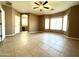 Large, bright main bedroom with ceiling fan and ensuite bathroom at 11946 W Jackson St, Avondale, AZ 85323