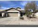 Charming single story home with desert landscaping, two car garage, and covered porch at 11946 W Jackson St, Avondale, AZ 85323