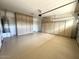 Large garage with ample storage cabinets and epoxy flooring at 11946 W Jackson St, Avondale, AZ 85323