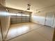 Spacious two-car garage with epoxy floor and side door at 11946 W Jackson St, Avondale, AZ 85323