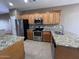 Kitchen with stainless steel appliances and granite counters at 11946 W Jackson St, Avondale, AZ 85323