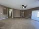 Large open living room featuring tile flooring and a ceiling fan at 11946 W Jackson St, Avondale, AZ 85323