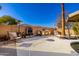 Backyard with stone outdoor kitchen, grill, seating, and a cozy fireplace at 1202 E Milada Dr, Phoenix, AZ 85042