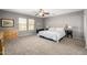 Serene bedroom with neutral walls, ample natural light, and comfortable furnishings at 1202 E Milada Dr, Phoenix, AZ 85042