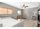 Well-lit bedroom featuring a unique window and simple furnishings at 1202 E Milada Dr, Phoenix, AZ 85042