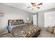 Comfortable bedroom with warm lighting, soft bedding, and a tranquil ambiance at 1202 E Milada Dr, Phoenix, AZ 85042