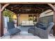 Outdoor gazebo with comfortable seating, ceiling fan, and decorative string lights at 1202 E Milada Dr, Phoenix, AZ 85042