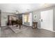 Cozy living room with a piano, hardwood floors, and natural light at 1202 E Milada Dr, Phoenix, AZ 85042