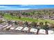 Scenic aerial view of a residential neighborhood near a lush golf course and mountains at 12215 S Potomac St, Phoenix, AZ 85044