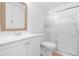 Clean bathroom with a white vanity, toilet, and a glass-enclosed shower at 12215 S Potomac St, Phoenix, AZ 85044