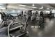 Fully equipped gym with cardio machines, weight training equipment, and mirrored walls at 12215 S Potomac St, Phoenix, AZ 85044