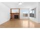 Inviting living room with a brick fireplace and plenty of natural light at 12215 S Potomac St, Phoenix, AZ 85044