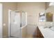 Bathroom featuring a glass-enclosed shower and a vanity with a sink and mirror at 1301 N Jackson St, Chandler, AZ 85225