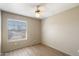 Bedroom featuring light-colored walls, light wood floors, a ceiling fan, and a window with blinds at 1301 N Jackson St, Chandler, AZ 85225