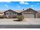 Charming single-story home featuring a two car garage, tile roof, desert landscaping, and a well-maintained front yard at 1301 N Jackson St, Chandler, AZ 85225