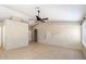 Inviting living room features tile flooring, neutral walls, a ceiling fan, and a decorative wall design at 1301 N Jackson St, Chandler, AZ 85225