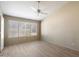 Cozy main bedroom boasting wood-look flooring, large window, and neutral walls for a serene retreat at 1301 N Jackson St, Chandler, AZ 85225