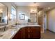 Stylish bathroom with granite countertops, updated fixtures, and a beautifully tiled shower at 1335 E Oregon Ave, Phoenix, AZ 85014