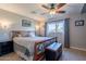 Relaxing bedroom showcasing a wooden bed frame, soft lighting and calming color palette at 1335 E Oregon Ave, Phoenix, AZ 85014