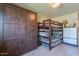 Cozy bedroom featuring a functional built-in Murphy bed and a charming bunk bed at 1335 E Oregon Ave, Phoenix, AZ 85014