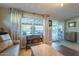 Bright living room with large windows, sliding glass doors, and stylish furnishings at 1335 E Oregon Ave, Phoenix, AZ 85014