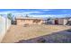 Large backyard showcases ample space, a block fence, and a storage shed at 1340 N Oregon St, Chandler, AZ 85225