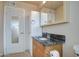 Bathroom featuring a granite vanity, linen closet, and tub/shower at 1340 N Oregon St, Chandler, AZ 85225