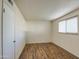 Bright bedroom features laminate floors and a window for natural light at 1340 N Oregon St, Chandler, AZ 85225