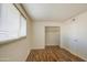 Bedroom features wood-look flooring, a window and a closet at 1340 N Oregon St, Chandler, AZ 85225