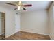 Bedroom features wood-look flooring, a closet and a ceiling fan at 1340 N Oregon St, Chandler, AZ 85225