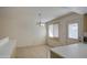 Dining area with tile floors, chandelier and a door to the outside at 1340 N Oregon St, Chandler, AZ 85225