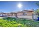 Exterior shot of the house with sunny skies, featuring a covered carport and desert landscaping at 1340 N Oregon St, Chandler, AZ 85225