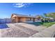 Charming single story home with neutral paint, covered carport, and low maintenance gravel yard at 1340 N Oregon St, Chandler, AZ 85225