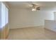 Spacious living room with neutral paint, tile floors, ceiling fan, and natural light at 1340 N Oregon St, Chandler, AZ 85225