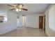 Bright living room with tile floors, ceiling fan, and open layout into the kitchen at 1340 N Oregon St, Chandler, AZ 85225