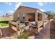 Inviting outdoor space with brick pavers, seating area, and a fire pit at 13624 W Desert Moon Way, Peoria, AZ 85383