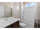 Bathroom featuring a single sink vanity, toilet, and tiled shower/tub at 13624 W Desert Moon Way, Peoria, AZ 85383