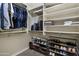 Spacious walk-in closet with ample storage for clothes, shoes, and accessories at 13624 W Desert Moon Way, Peoria, AZ 85383