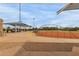 Exterior shot of a baseball field with covered picnic tables and protective netting around the field at 14008 N 61St Ave, Glendale, AZ 85306