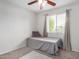 Cozy bedroom featuring a ceiling fan and a window allowing plenty of natural light at 14008 N 61St Ave, Glendale, AZ 85306