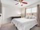 Relaxing bedroom with a plush bed, soft lighting, and a dark wood dresser for storage at 14008 N 61St Ave, Glendale, AZ 85306