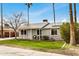 Cozy home with green lawn, solar panels, and comfortable outdoor seating area at 14008 N 61St Ave, Glendale, AZ 85306