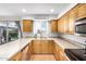 Bright kitchen featuring ample counter space, light wood cabinets, and modern fixtures for meal preparation at 14008 N 61St Ave, Glendale, AZ 85306