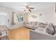 Bright living room with neutral paint, tile flooring, and ample natural light at 14008 N 61St Ave, Glendale, AZ 85306