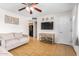 Cozy living room with tile floors, TV, and open access to the kitchen at 14008 N 61St Ave, Glendale, AZ 85306