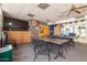 Well-lit meeting room with tile ceiling, large table, chairs, and a flat screen tv for presentations at 14008 N 61St Ave, Glendale, AZ 85306