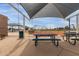 Picnic tables offer a space for dining near the baseball field under shaded covers at 14008 N 61St Ave, Glendale, AZ 85306