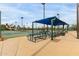 Exterior view of the tennis courts and picnic benches at 14008 N 61St Ave, Glendale, AZ 85306